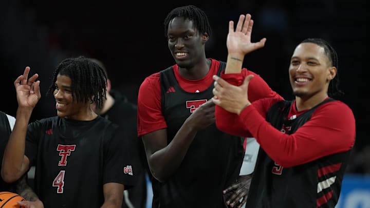 Mar 19, 2025; Wichita, KS, USA; Texas Tech Red Raiders guard Christian Anderson (4), forward Federiko Federiko (33) and forward Darrion Williams (5) react during practice at Intrust Bank Arena. Mandatory Credit: Kirby Lee-Imagn Images