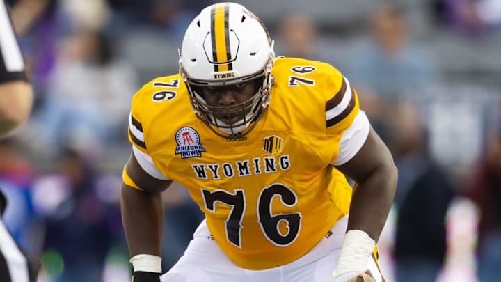 Dec 30, 2022; Tucson, AZ, USA; Wyoming Cowboys guard Emmanuel Pregnon (76) against the Ohio Bobcats during the 2022 Barstool Sports Arizona Bowl at Arizona Stadium.