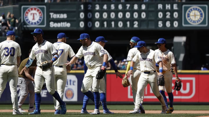Seattle Mariners players celebrate a 5-0 victory against the Texas Rangers  at T-Mobile Park on June 16.