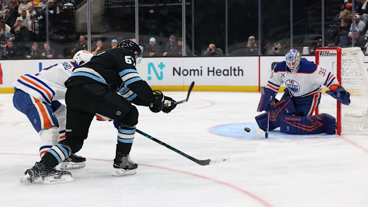 Mar 24, 2026; Salt Lake City, Utah, USA; Edmonton Oilers goaltender Tristan Jarry (35) blocks a shot by Utah Mammoth left wing Lawson Crouse (67) during the third period at Delta Center. Mandatory Credit: Rob Gray-Imagn Images