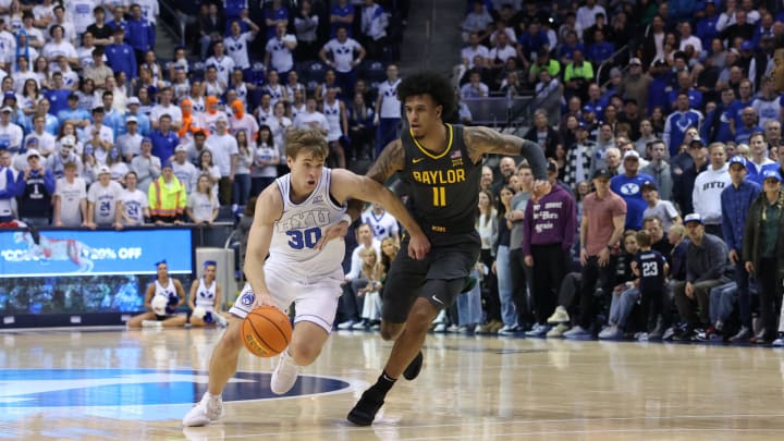 Feb 20, 2024; Provo, Utah, USA; Brigham Young Cougars guard Dallin Hall (30) dribbles past Baylor Bears forward Jalen Bridges (11) during the second half at Marriott Center. Mandatory Credit: Rob Gray-USA TODAY Sports Feb 20, 2024; Provo, Utah, USA; Brigham Young Cougars guard Dallin Hall (30) dribbles past Baylor Bears forward Jalen Bridges (11) during the second half at Marriott Center. Mandatory Credit: Rob Gray-USA TODAY Sports