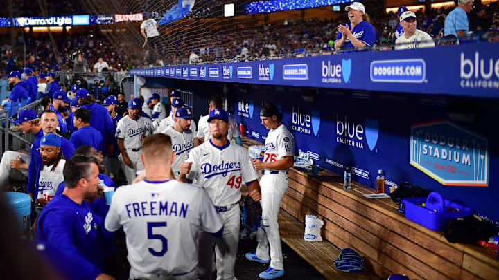 Aug 15, 2025; Los Angeles, California, USA; Los Angeles Dodgers pitcher Blake Treinen (49) is greeted by first baseman Freddie Freeman (5) following the top of the eighth inning against the San Diego Padres at Dodger Stadium. Mandatory Credit: Gary A. Vasquez-Imagn Images Aug 15, 2025; Los Angeles, California, USA; Los Angeles Dodgers pitcher Blake Treinen (49) is greeted by first baseman Freddie Freeman (5) following the top of the eighth inning against the San Diego Padres at Dodger Stadium. Mandatory Credit: Gary A. Vasquez-Imagn Images