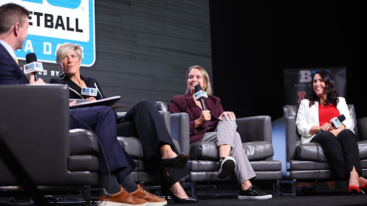 Oct 2, 2024; Rosemont, IL, USA; Iowa head coach Jen Jensen, left, Minnesota head coach Dawn Plitzuweit, middle, Nebraska head coach Amy Williams, right, speak with Mike Hall during the 2024 Big Ten Womenís Basketball media day at Donald E. Stephens Convention Center.