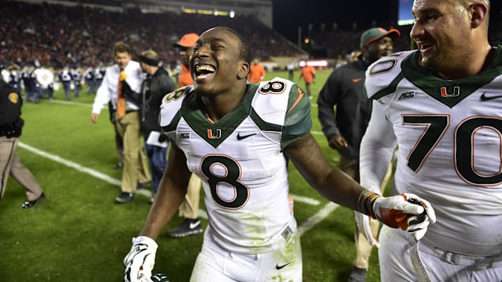 Oct 23, 2014; Blacksburg, VA, USA; Miami Hurricanes running back Duke Johnson (8) runs off the field with offensive lineman Jon Feliciano (70) at halftime at Lane Stadium. Mandatory Credit: Bob Donnan-Imagn Images Oct 23, 2014; Blacksburg, VA, USA; Miami Hurricanes running back Duke Johnson (8) runs off the field with offensive lineman Jon Feliciano (70) at halftime at Lane Stadium. Mandatory Credit: Bob Donnan-Imagn Images