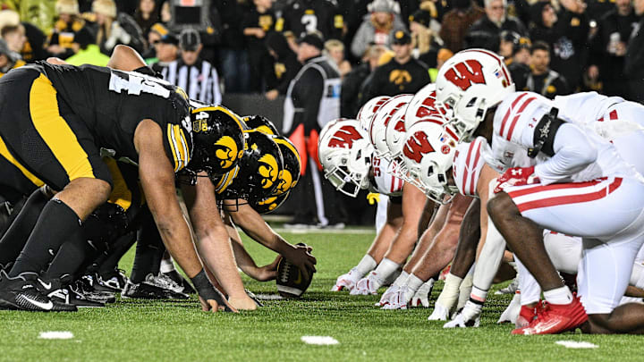 Nov 2, 2024; Iowa City, Iowa, USA; The line of scrimmage between the Iowa Hawkeyes and the Wisconsin Badgers during the fourth quarter at Kinnick Stadium. Mandatory Credit: Jeffrey Becker-Imagn Images
