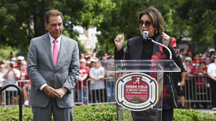 Sep 7, 2024; Tuscaloosa, Alabama, USA;  Former Alabama head coach Nick Saban listens as his wife Terry Saban speaks as the University of Alabama renames the field in his honor at Bryant-Denny Stadium. The new name is Saban Field at Bryant-Denny Stadium