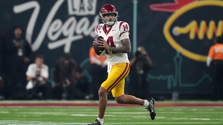 Dec 27, 2024; Las Vegas, NV, USA; Southern California Trojans quarterback Jayden Maiava (14) throws the ball against the Texas A&M Aggies in the first half at Allegiant Stadium. Mandatory Credit: Kirby Lee-Imagn Images