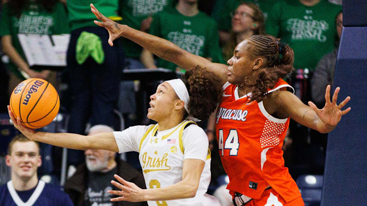 Notre Dame guard Hannah Hidalgo, left, drives to the basket with Syracuse center Uche Izoje (44) guarding during a NCAA women's basketball game at Purcell Pavilion on Thursday, Feb. 26, 2026, in South Bend. Notre Dame guard Hannah Hidalgo, left, drives to the basket with Syracuse center Uche Izoje (44) guarding during a NCAA women's basketball game at Purcell Pavilion on Thursday, Feb. 26, 2026, in South Bend.