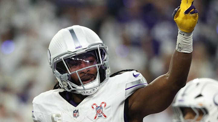 Dec 25, 2025; Minneapolis, Minnesota, USA; Minnesota Vikings running back Aaron Jones Sr. (33) celebrates after scoring a touchdown against the Detroit Lions in the first quarter at U.S. Bank Stadium. Mandatory Credit: Matt Krohn-Imagn Images