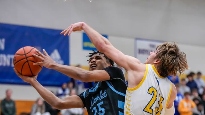 Nicolet's Davion Hannah (25) is fouled under the hoop by Catholic Memorial's Bennett McCormick (23) during the game in Waukesha, Tuesday, Jan. 17, 2023.
Wcn Ns Bball 2083 Nicolet's Davion Hannah (25) is fouled under the hoop by Catholic Memorial's Bennett McCormick (23) during the game in Waukesha, Tuesday, Jan. 17, 2023.
Wcn Ns Bball 2083