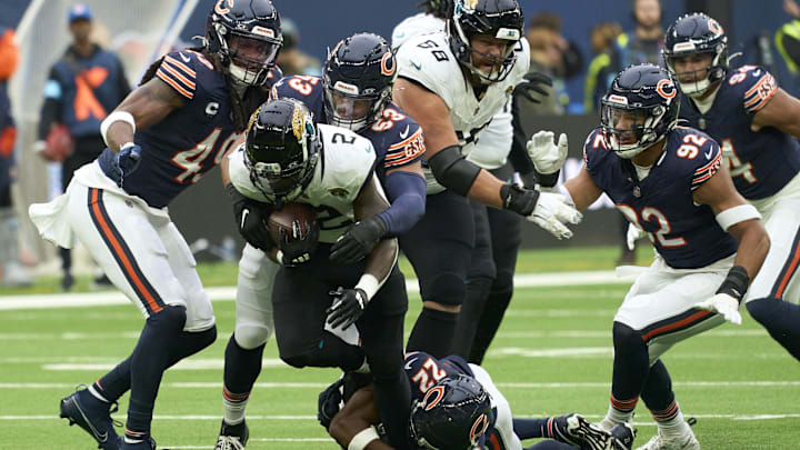 The Bears defense drags down D'Ernest Johnson in Sunday's 35-16 victory over Jacksonville in London. The Bears defense drags down D'Ernest Johnson in Sunday's 35-16 victory over Jacksonville in London.