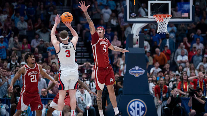 Mississippi Rebels guard Sean Pedulla (3) shoots over Arkansas Razorbacks forward Trevon Brazile (4) for the game-winning shot during their second round game of the SEC Men's Basketball Tournament at Bridgestone Arena in Nashville, Tenn., Thursday, March 13, 2025. The Rebels advanced to the third round with the 83-80 win.