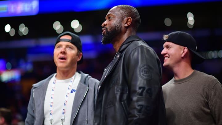Nov 19, 2024; Los Angeles, California, USA; Utah Jazz minority owner Dwyane Wade with majority owner Ryan Smith (left) watch game action against the Los Angeles Lakers during the second half at Crypto.com Arena. Mandatory Credit: Gary A. Vasquez-Imagn Images