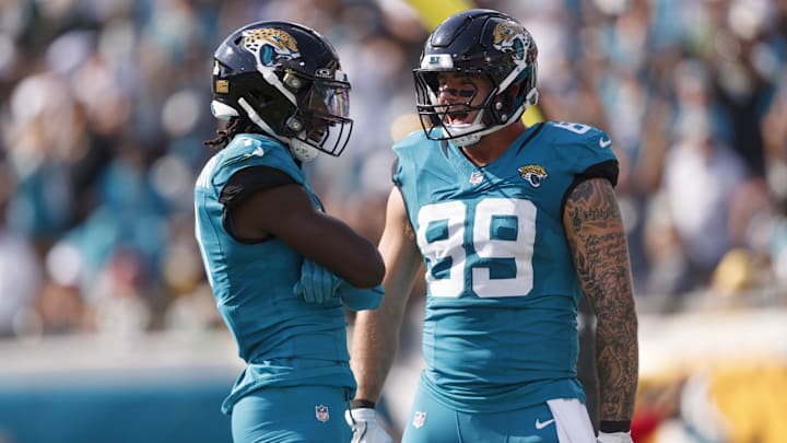 Oct 27, 2024; Jacksonville, Florida, USA; Jacksonville Jaguars wide receiver Brian Thomas Jr. (7) and tight end Luke Farrell (89) celebrate a touchdown against the Green Bay Packers during the third quarter at EverBank Stadium. Mandatory Credit: Morgan Tencza-Imagn Images