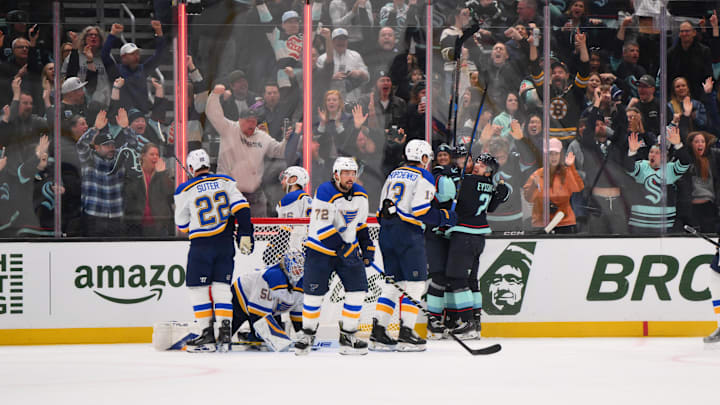 Apr 12, 2025; Seattle, Washington, USA; The Seattle Kraken celebrate after a goal scored by center Shane Wright (51) during the third period against the St. Louis Blues at Climate Pledge Arena. Mandatory Credit: Steven Bisig-Imagn Images