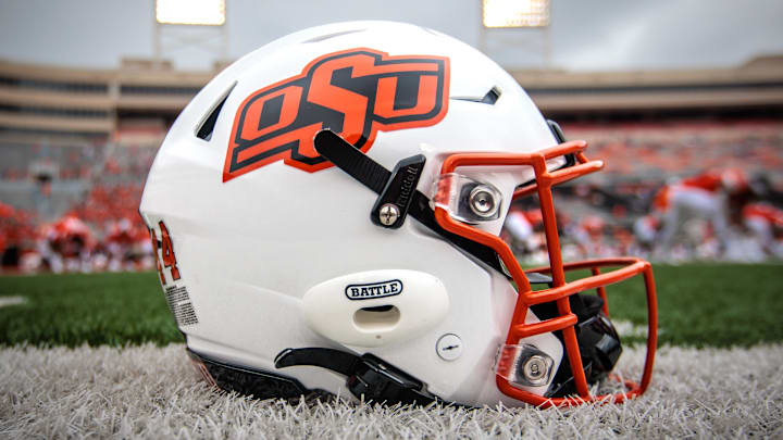 Aug 31, 2024; Stillwater, Oklahoma, USA; Oklahoma State Cowboys helmet sits on the field prior to the game against the South Dakota State Jackrabbits at Boone Pickens Stadium. Mandatory Credit: William Purnell-Imagn Images Aug 31, 2024; Stillwater, Oklahoma, USA; Oklahoma State Cowboys helmet sits on the field prior to the game against the South Dakota State Jackrabbits at Boone Pickens Stadium. Mandatory Credit: William Purnell-Imagn Images