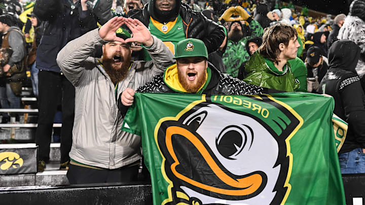 Nov 8, 2025; Iowa City, Iowa, USA; Oregon Ducks fans react after the game against the Iowa Hawkeyes at Kinnick Stadium. Mandatory Credit: Jeffrey Becker-Imagn Images