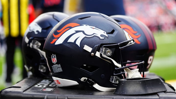 Aug 25, 2024; Denver, Colorado, USA; Detail view of the helmets worn by the Denver Broncos during the second half against the Arizona Cardinals t Empower Field at Mile High. Mandatory Credit: Ron Chenoy-Imagn Images