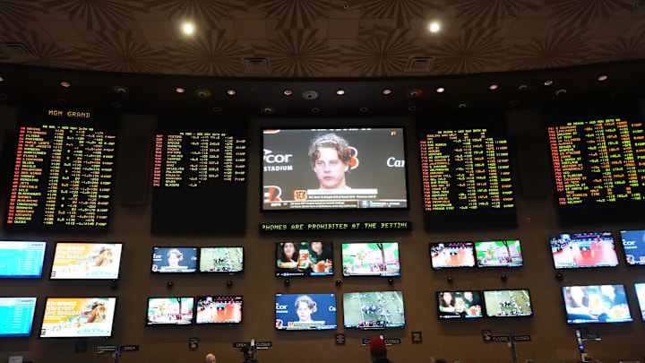 Nov 26, 2025; Las Vegas, NV, USA; Cincinnati Bengals quarterback Joe Burrow on a television screen at the BetMGM Sportsbook at MGM Grand hotel and casino. Mandatory Credit: Kirby Lee-Imagn Images