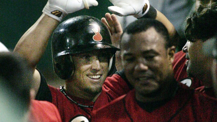 Nashville Sounds’ Trent Durrington, in batting helmet, gets high fives from teammates after hitting a home run in the team’s 3-1 win over Oklahoma in Game 4 of the PCL American Conference playoffs on Sept. 10, 2005. The Sounds tied the best-of-five series 2-2 in front of 3,775 fans at Greer Stadium.