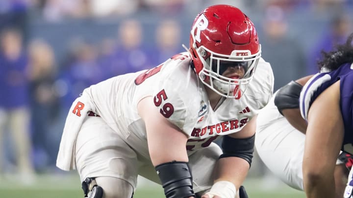 Dec 26, 2024; Phoenix, AZ, USA; Rutgers Scarlet Knights offensive lineman Gus Zilinskas (59) against the Kansas State Wildcats during the Rate Bowl at Chase Field. Mandatory Credit: Mark J. Rebilas-Imagn Images