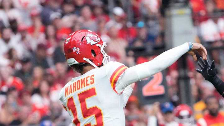 Kansas City Chiefs quarterback Patrick Mahomes (15) throws a pass while pressured by Arizona Cardinals safety Budda Baker (3) during the second quarter at State Farm Stadium in Glendale on Sept. 11, 2022.
