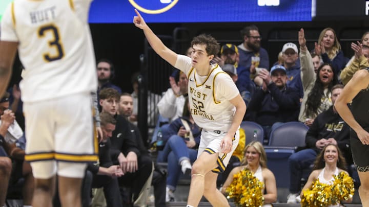 Jan 17, 2026; Morgantown, West Virginia, USA; West Virginia Mountaineers guard Treysen Eaglestaff (52) celebrates after a made three point basket during the first half against the Colorado Buffaloes at Hope Coliseum. Mandatory Credit: Ben Queen-Imagn Images