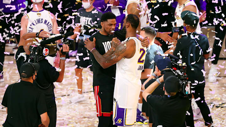 Oct 11, 2020; Lake Buena Vista, Florida, USA; Los Angeles Lakers forward LeBron James (23) hugs Miami Heat forward Udonis Haslem (40) after game six of the 2020 NBA Finals at AdventHealth Arena. The Los Angeles Lakers won 106-93 to win the series. Mandatory Credit: Kim Klement-USA TODAY Sports