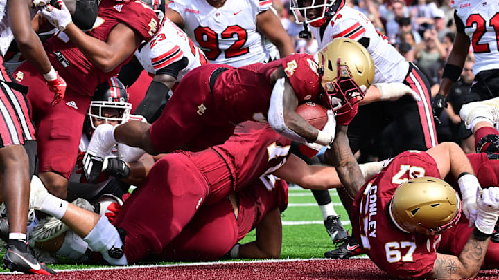 Sep 28, 2024; Chestnut Hill, Massachusetts, USA; Boston College Eagles running back Kye Robichaux (5) leaps into the endzone for a touchdown against the Western Kentucky Hilltoppers during the first half at Alumni Stadium. Mandatory Credit: Eric Canha-Imagn Images