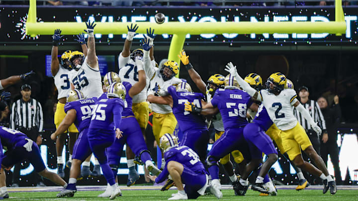 Oct 5, 2024; Seattle, Washington, USA; Washington Huskies place kicker Grady Gross (95) makes a field goal against the Michigan Wolverines, including Michigan Wolverines defensive lineman Mason Graham (55), defensive lineman Kenneth Grant (78), defensive end TJ Guy (42) and defensive back Will Johnson (2) during the fourth quarter at Alaska Airlines Field at Husky Stadium. Mandatory Credit: Joe Nicholson-Imagn Images Oct 5, 2024; Seattle, Washington, USA; Washington Huskies place kicker Grady Gross (95) makes a field goal against the Michigan Wolverines, including Michigan Wolverines defensive lineman Mason Graham (55), defensive lineman Kenneth Grant (78), defensive end TJ Guy (42) and defensive back Will Johnson (2) during the fourth quarter at Alaska Airlines Field at Husky Stadium. Mandatory Credit: Joe Nicholson-Imagn Images