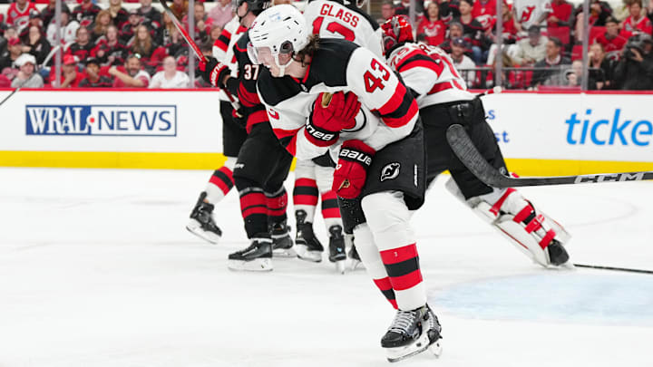 Luke Hughes (43) reacts after a play against the Carolina Hurricanes.  Mandatory Credit: James Guillory-Imagn Images