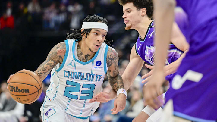Jan 10, 2026; Salt Lake City, Utah, USA; Charlotte Hornets guard Tre Mann (23) makes a quick move on Utah Jazz guard Walter Clayton Jr. (13) during the second half at Delta Center. Mandatory Credit: Peter Creveling-Imagn Images