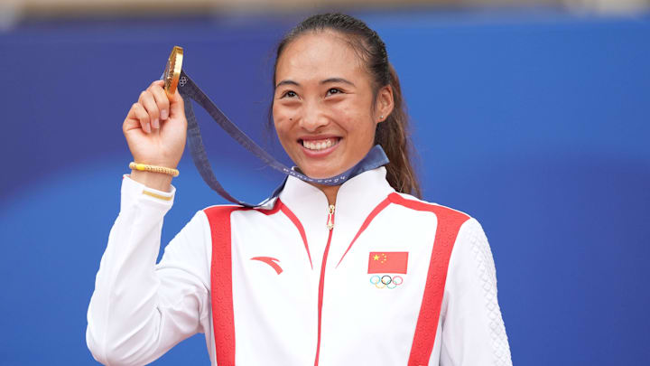 Qinwen Zheng holds her gold medal at the 2024 Summer Olympics in Paris, France.