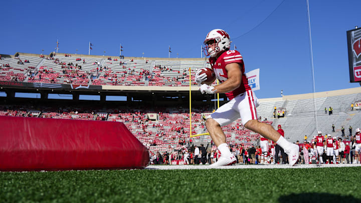 Oct 5, 2024; Madison, Wisconsin, USA;  Wisconsin Badgers running back Cade Yacamelli (25) warms up prior to the game against the Purdue Boilermakers at Camp Randall Stadium. 