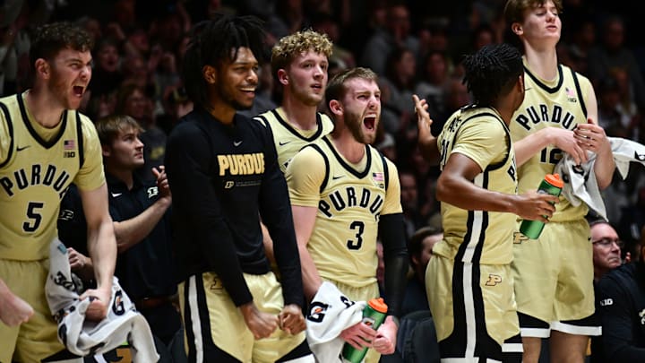 The Purdue Boilermakers bench celebrates a basket