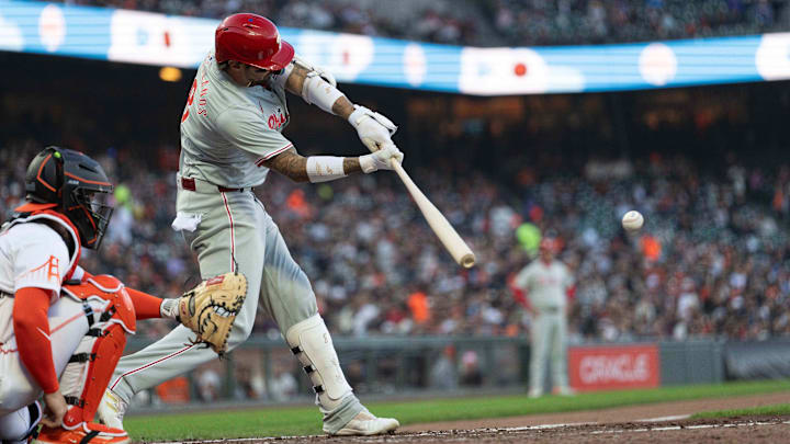 May 28, 2024; San Francisco, California, USA;  Philadelphia Phillies outfielder Nick Castellanos (8) hits a single during the fourth inning against the San Francisco Giants at Oracle Park.