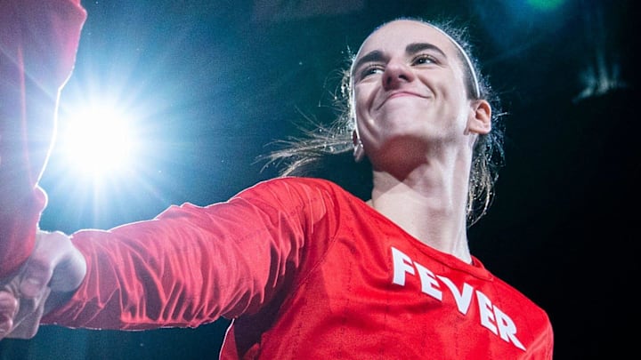 Jul 6, 2024; Indianapolis, Indiana, USA; Indiana Fever guard Caitlin Clark (22) is introduced before a game against the New York Liberty at Gainbridge Fieldhouse. Mandatory Credit: Grace Smith/INDIANAPOLIS STAR-USA TODAY Sports