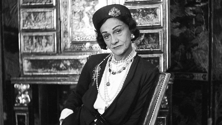 Designer Gabrielle "Coco" Chanel, wearing her signature pearls and jeweled pillbox hat, photographed by Cecil Beaton in 1953. Designer Gabrielle "Coco" Chanel, wearing her signature pearls and jeweled pillbox hat, photographed by Cecil Beaton in 1953.