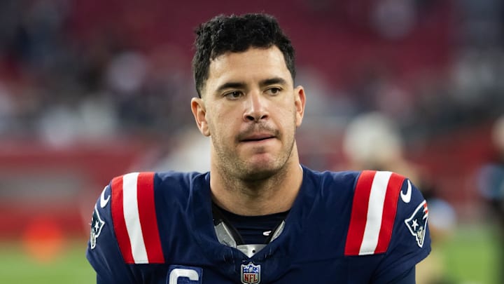 Dec 15, 2024; Glendale, Arizona, USA; New England Patriots long snapper Joe Cardona (49) against the Arizona Cardinals at State Farm Stadium. Mandatory Credit: Mark J. Rebilas-Imagn Images
