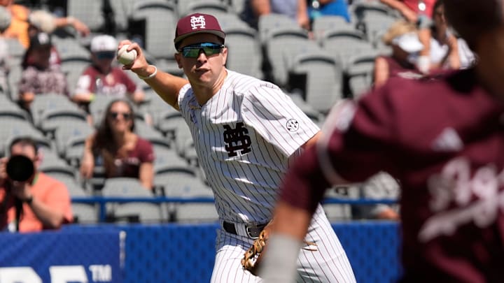 Mississippi State Bulldogs third baseman Ace Reese (3) fields a bunt by Texas A&M second baseman Ben Royo (10) but makes a wild throw to first in the first round of the SEC Baseball Tournament at the Hoover Met.