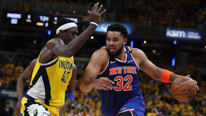 May 27, 2025; Indianapolis, Indiana, USA; New York Knicks center Karl-Anthony Towns (32) drives to the hoop past Indiana Pacers forward Pascal Siakam (43) during the third quarter of game four of the eastern conference finals for the 2025 NBA Playoffs at Gainbridge Fieldhouse. Mandatory Credit: Trevor Ruszkowski-Imagn Images