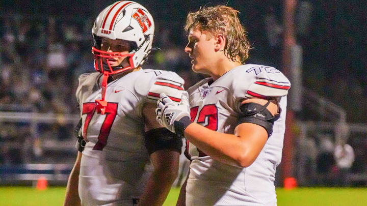 Sussex Hamilton linemen Hunter Mallinger (77) and Reece Mallinger (72) are pictured during the football game against Germantown, Sept. 19, 2025, in Germantown, Wisconsin. Hamilton won the game, 23-21.