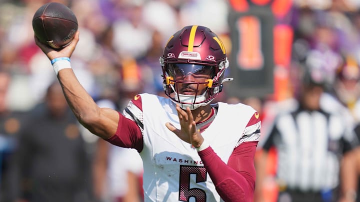 Oct 13, 2024; Baltimore, Maryland, USA; Washington Commanders quarterback Jayden Daniels (5) throws a first quarter pass against the Baltimore Ravens at M&T Bank Stadium. Mandatory Credit: Mitch Stringer-Imagn Images