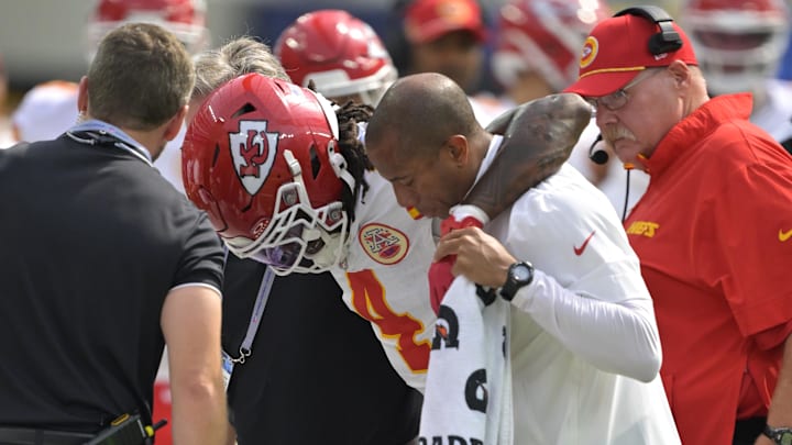 Sep 29, 2024; Inglewood, California, USA;  Kansas City Chiefs wide receiver Rashee Rice (4) is assisted by medical staff after an injury in the first half against the Los Angeles Chargers at SoFi Stadium. Mandatory Credit: Jayne Kamin-Oncea-Imagn Images