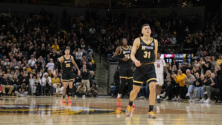 Jan. 18 2024; Columbia, Missouri, USA; Missouri Tigers guard Caleb Grill (31), forward Mark Mitchell (25) and guard Jacob Crews (35) against the Arkansas Razorbacks at Mizzou Arena. / Amber Winkler/Missouri Tigers On SI / Amber Winkler