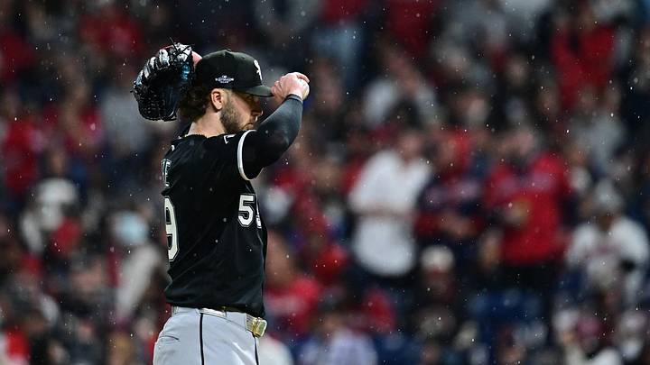 Oct 10, 2026: Chicago White Sox pitcher Sean Burke (59) adjusts his cap in the rain during the second inning against the Cleveland Guardians in game five of the ALDS for the 2026 MLB Playoffs at Progressive Field. Credit: David Dermer-Imagn Images
