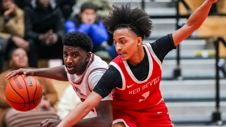 Pike Red Devils guard Aiden Woods (3) guards North Central Panthers Nijah Jewell (5) on Friday, Jan. 17, 2025, during the IHSAA boys basketball Marion County tournament semifinals at Southport Fieldhouse in Indianapolis.