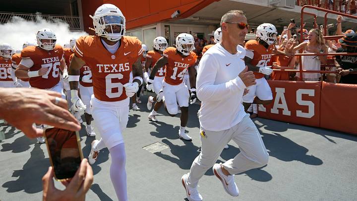 Texas Longhorns Head Coach Steve Sarkisian leads his team on to the field before a game against the Texas State Bobcats Texas Longhorns Head Coach Steve Sarkisian leads his team on to the field before a game against the Texas State Bobcats