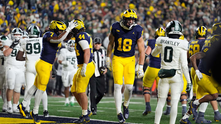 Michigan tight end Colston Loveland (18) celebrates scoring a touchdown against Michigan State during the second half at Michigan Stadium in Ann Arbor on Saturday, Oct. 26, 2024.