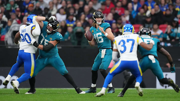 Oct 19, 2025; London, United Kingdom; Jacksonville Jaguars quarterback Trevor Lawrence (16) looks to pass the ball against the Los Angeles Rams during the first half of an NFL International Series game at Wembley Stadium. Mandatory Credit: Kirby Lee-Imagn Images Oct 19, 2025; London, United Kingdom; Jacksonville Jaguars quarterback Trevor Lawrence (16) looks to pass the ball against the Los Angeles Rams during the first half of an NFL International Series game at Wembley Stadium. Mandatory Credit: Kirby Lee-Imagn Images
